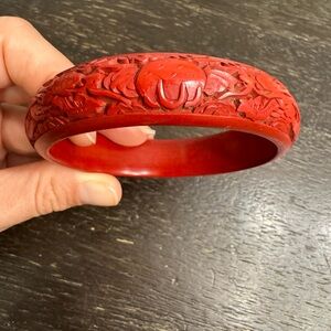 Stunning thick band cinnabar red dragon and elephant engraved bangle!
